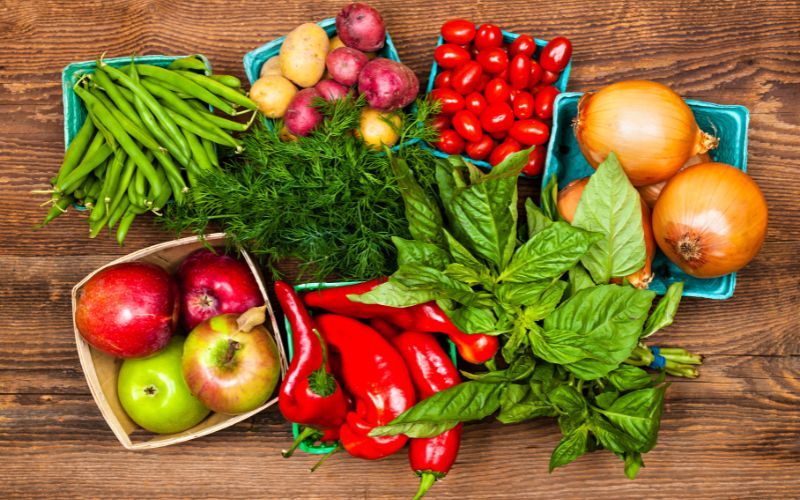 Best Foods for Menopause: Nourishing Your Body During Weight Loss 3 A colorful array of fruits and vegetables displayed on a wooden table : Best foods for menopause