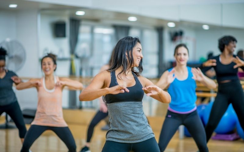 Common Mistakes to Avoid on The Menopause Diet 5 Day Plan 5 A group of women engaging in a fun exercise class, such as Zumba or yoga : Common mistakes to avoid on menopause diet