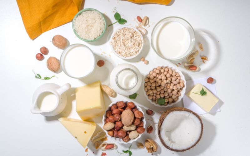 Best Foods for Menopause: Nourishing Your Body During Weight Loss 5 A variety of dairy products including yogurt and cheese alongside plant based alternatives