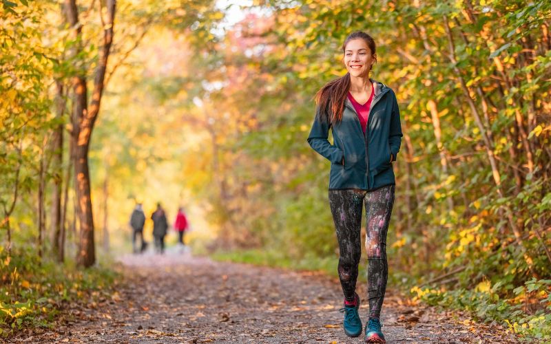 Best Exercise for Menopause: Effective Workouts to Support Weight Loss 3 Woman brisk walking in a park or on a trail : Best exercise for menopause