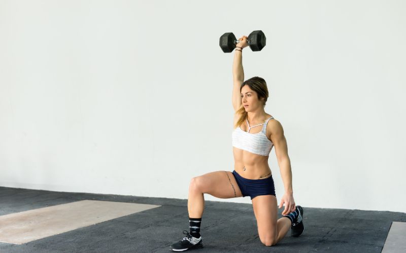 Best Exercise for Menopause: Effective Workouts to Support Weight Loss 2 Woman performing strength training with dumbbells : best exercise formenopause
