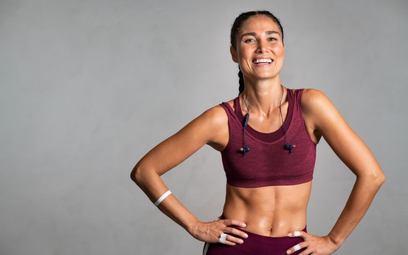 Best Exercise for Menopause: Effective Workouts to Support Weight Loss 6 Woman smiling after completing an exercise routine, feeling accomplished : Best exercise for menopause